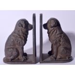 A PAIR OF CAST IRON BOOKENDS IN THE FORM OF DOGS, formed seated. 20 cm high.