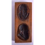 A MID 19TH CENTURY CARVED BOXWOOD AND COPPER SEAL STAMP depicting two males. 3.5 cm x 8.5 cm.