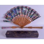 A RARE 19TH CENTURY CHINESE SANDALWOOD PAINTED IVORY FAN decorated with figures within landscapes.