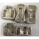 A GROUP OF FIVE CHINESE WHITE METAL INGOTS, varying shape. Largest 6.5 cm wide. (5)