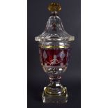 A RARE BOHEMIAN TRIPLE COLOUR GLASS VASE AND COVER decorated with figures and putti. 31 cm high.