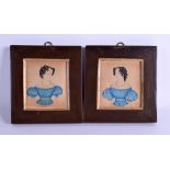 A PAIR OF EARLY 19TH CENTURY PAINTED PORTRAIT MINIATURES depicting figures within a blue dress. 8.5