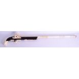 AN UNUSUAL CONTINENTAL BONE AND WOOD IMITATION HUNTING RIFLE. 92 cm long.