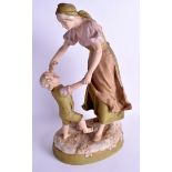 A LARGE AUSTRIAN ROYAL DUX FIGURE OF A FEMALE modelled holding aloft a boy hands. 39 cm high.