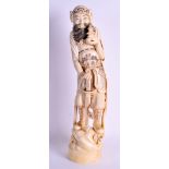 A LARGE 19TH CENTURY JAPANESE MEIJI PERIOD CARVED IVORY OKIMONO modelled as a male holding a sword.