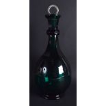 AN ANTIQUE GREEN GLASS DECANTER with silver ring stopper. 31 cm high.