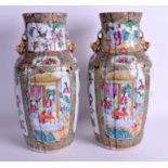 A RARE PAIR OF 19TH CENTURY CHINESE CANTON FAMILLE ROSE RIBBED VASES Qing. 36 cm high.