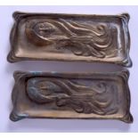 A PAIR OF BRASS DISHES. 24 cm x 10 cm.