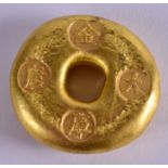 A CHINESE YELLOW METAL INGOT. 109 grams. 3.5 cm wide.