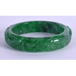 A CHINESE JADE BANGLE. 7 cm diameter.