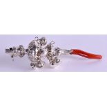 A SILVER AND CORAL BABIES RATTLE. 13 cm long.