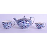 AN ANTIQUE CHINTZ TEAPOT AND COVER together with two others. Largest 19 cm wide. (3)