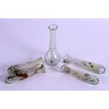 FIVE EARLY GLASS BOTTLES. 11 cm high. (5)