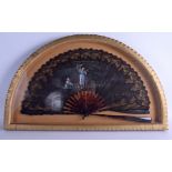 A LARGE 19TH CENTURY CONTINENTAL FRAMED TORTOISESHELL FAN painted with lovers within a landscape. F