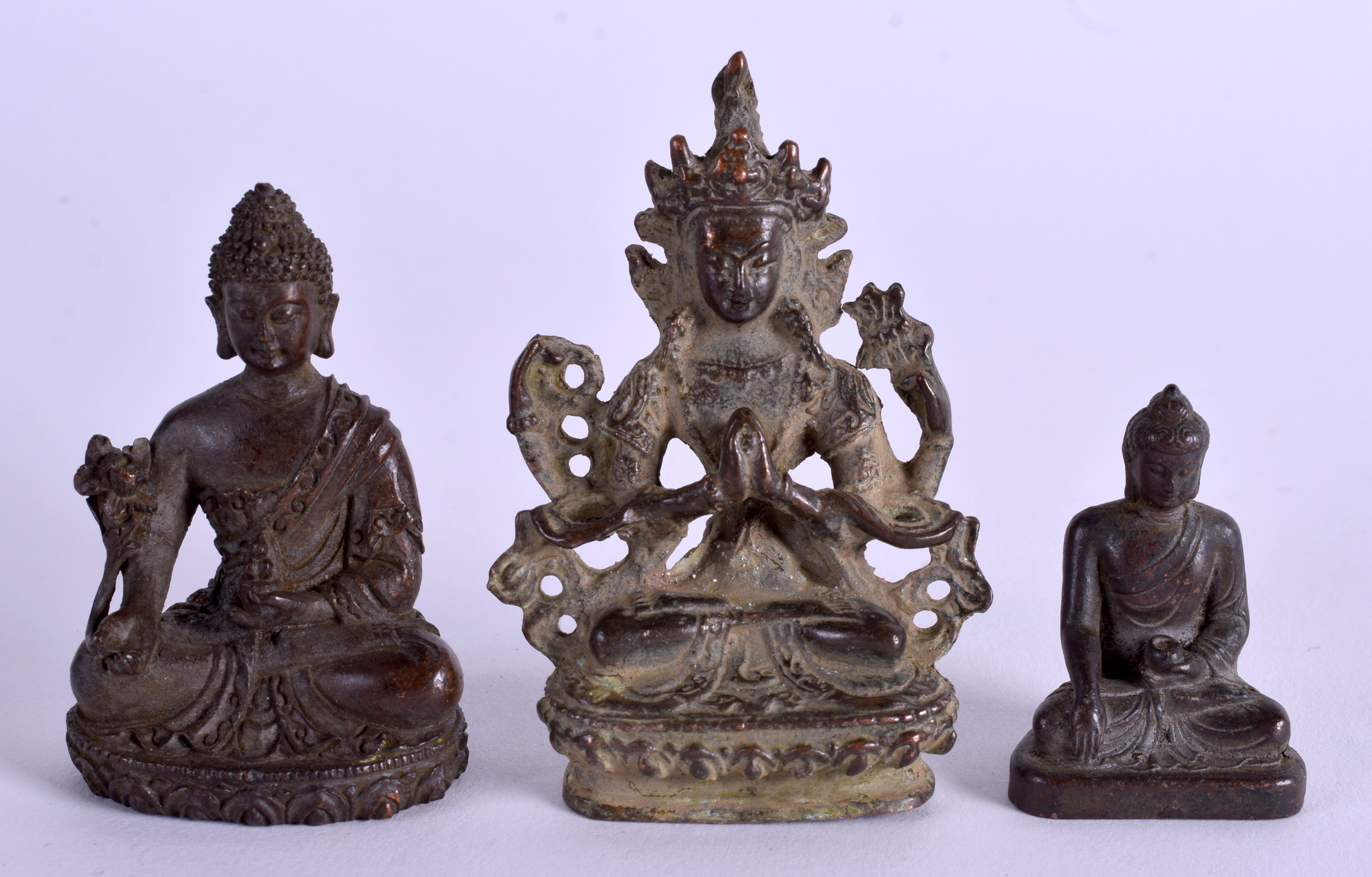 THREE ASIAN BUDDHAS. Largest 7.5 cm high. (3)