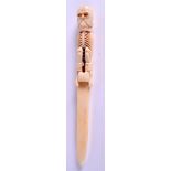 A SKELETON LETTER OPENER. 24 cm long.