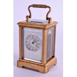 A MINIATURE BRASS CARRIAGE CLOCK. 7 cm high inc handle.