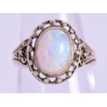 A GOLD AND OPAL RING. Size L.