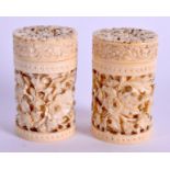 A PAIR OF 19TH CENTURY CHINESE CARVED IVORY CANS. 4.5 cm high.