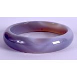 A CHINESE AGATE BANGLE. 8 cm wide.