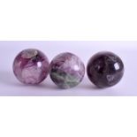 THREE BLUEJOHN STYLE BALLS. 8 cm wide.