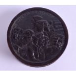 A RARE EARLY 19TH CENTURY CARVED HORN SNUFF BOX depicting the Oratorio of Judith. 7.5 cm diameter.