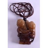 A CHINESE JADE BOYS PENDANT. 4 cm x 5 cm.