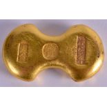 A CHINESE YELLOW METAL INGOT. 219 grams. 6.5 cm x 3.5 cm.