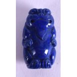 A CHINESE CARVED LAPIS LAZULI TOGGLE. 3 cm x 2 cm.