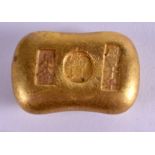 A CHINESE YELLOW METAL INGOT. 135 grams. 4.5 cm x 2.5 cm.