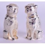 A PAIR OF SILVER PLATED DOG CONDIMENTS. 8 cm high.