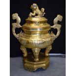 A VERY LARGE 18TH/19TH CENTURY CHINESE TWIN HANDLED BRONZE CENSER with stand, decorated with mask h