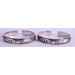 TWO CHINESE WHITE METAL BANGLES. 100 grams. 8 cm wide. (2)