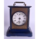 AN EBONISED MANTEL CLOCK. 16 cm high.