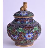 AN EARLY 20TH CENTURY CHINESE CLOISONNE ENAMEL JAR AND COVER depicting foliage. 14 cm x 11 cm.