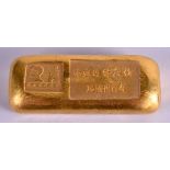 A CHINESE YELLOW METAL INGOT. 174 grams.