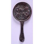 AN UNUSUAL ASIAN BRONZE HARD MIRROR. 9 cm x 4.5 cm.