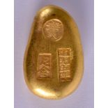 A CHINESE YELLOW METAL INGOT. 110 grams. 4.5 cm x 2 cm.