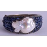 A GOOD RUSSIAN SILVER AND DIAMOND PEARL BANGLE, inset with sapphires. 7 cm wide.