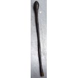 A TRIBAL WOODEN CLUB, formed with a bulbous end. 80 cm long.