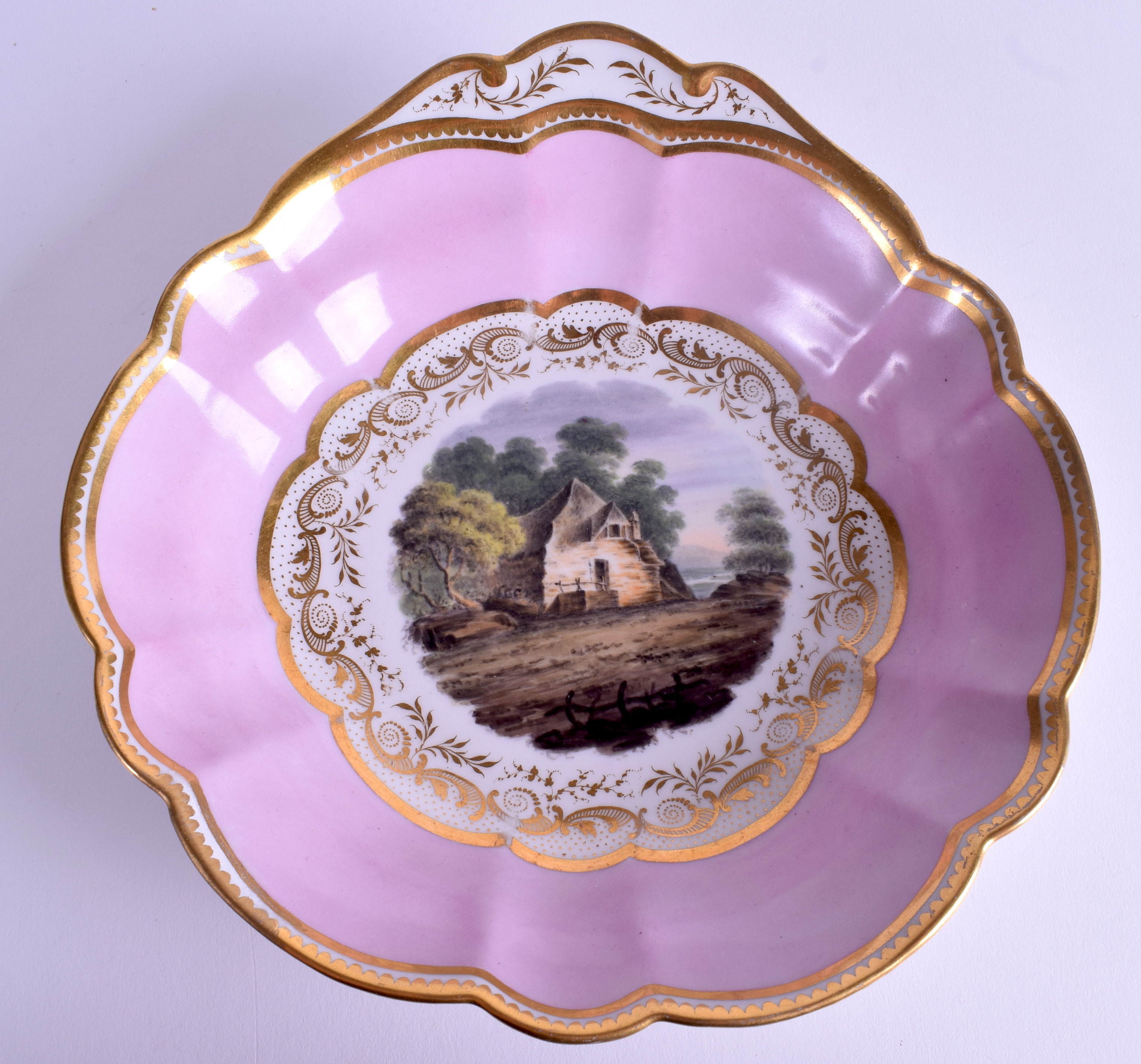 AN EARLY 19TH CENTURY FLIGHT BARR AND BARR SHELL SHAPED DISH painted with a cottage in Gloucester