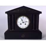 AN IMITATION SLATE WOODEN MANTEL CLOCK, formed with marble effect pillars. 32 cm wide.