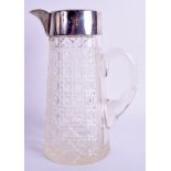 AN EDWARDIAN SILVER AND CRYSTAL GLASS JUG. 24 cm high.