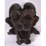 A LATE 19TH CENTURY BRONZE GARDEN FOUNTAIN HEAD SCULPTURE, formed with open mouth. 30.5 cm x 27 cm.