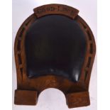 A NOVELTY JOCKEY'S ELM STOOLl, with rexine padded seat, in the form of a horseshoe, inscribed 'Good