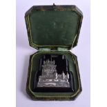 A CHARMING ANTIQUE CONTINENTAL SILVER PAPERWEIGHT decorated with a castle. 11 cm x 13 cm.
