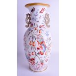 A LARGE VICTORIAN ENAMELLED OPALINE GLASS TWIN HANDLED VASE painted with birds amongst fruiting vin