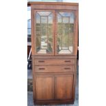 AN EARLY 20TH CENTURY OAK DISPLAY CABINET, formed with glass fronted doors.198 cm x 89 cm.