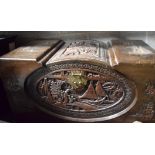 A CHINESE CAMPHOR WOOD CHEST, carved with landscape scenery. 51 cm x 85 cm.