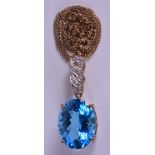 A 9CT GOLD NECKLACE INSET WITH A BLUE STONE, linked by a twist pendant. Stone 2 cm x 1.4 cm.